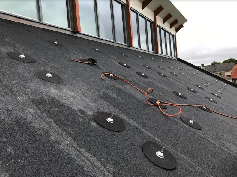 Mounting anchors on a pitched roof